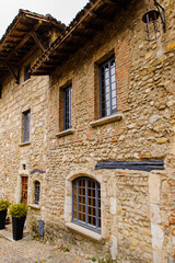 Close view of the authentic stone house of Perouges, France, a medieval walled town, a popular touristic attraction.