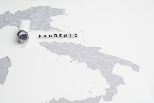 The word pandemic over world map,selective focus - Powered by Adobe
