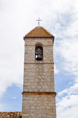 Fototapeta na wymiar It's Bell tower of the Old medieval church in Saint Paul de Vence, one of the oldest towns of the French riviera