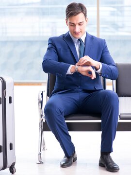 Businessman waiting at the airport for his plane in business cla