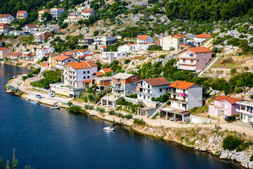 Fototapeta na wymiar It's Hotels and other houses at the coast of Croatia
