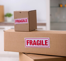 Man moving house and relocating with fragile items