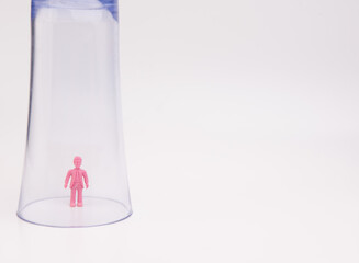 A toy inside a glass isolated over white background