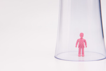 Obraz premium A toy inside a glass isolated over white background