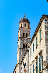 Fototapeta na wymiar It's Franciscan monastery bell tower in Dubrovnik, Croatia
