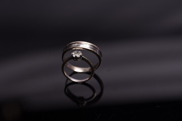 Wedding rings,isolated over dark reflective background