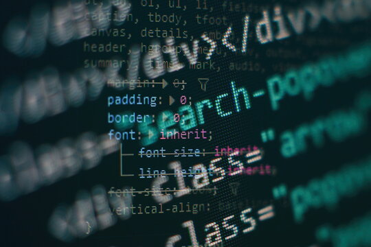 Closeup developing programming and coding technologies. Developer working on web sites codes in office.