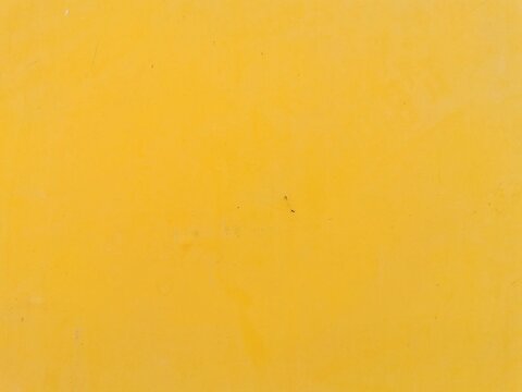 Stain on yellow steel sheet wall.