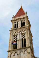 Fototapeta na wymiar It's Bell tower of the Cathedral of St. Lawrence (Katedrala Sv. Lovre), a Roman Catholic triple-naved basilica constructed in Romanesque-Gothic in Trogir, Croatia. UNESCO World heritage