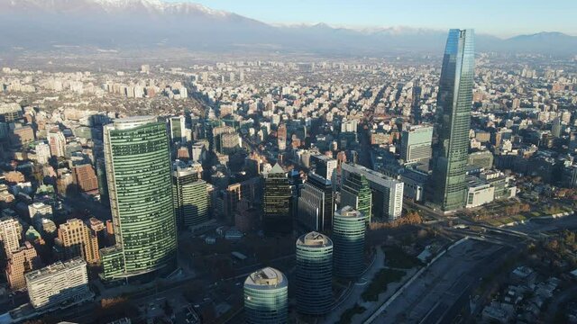 Aerial closing on glass buildings in the middle of the concrete jungle in Santiago, Chile