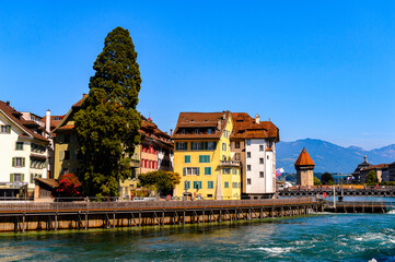 Fototapeta na wymiar Typical architecture on the river Reuss in Lucerne, a city in the German-speaking part of Switzerland