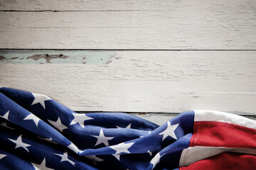 USA Flag Lying on Vintage Weathered Wooden Background. American Symbolic. 4th of July or Memorial...