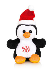 Little stuffed penguin toy with christmas cap. Isolated on white background with shadow reflection. With clipping path. Fatso on white. Cute fatty puppy stuffie plaything.