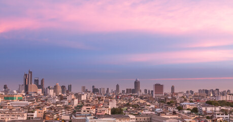 Fototapeta na wymiar Aerial view of Bangkok, Bangkok city downtown with sunset sky, Saw the small buildings and the tall buildings in the community in Bangkok