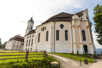 Fototapeta na wymiar Wies, Germany. The Pilgrimage Church of Wies (Wieskirche), an oval rococo church located in the foothills of the Alps, Bavaria. A World Heritage Site