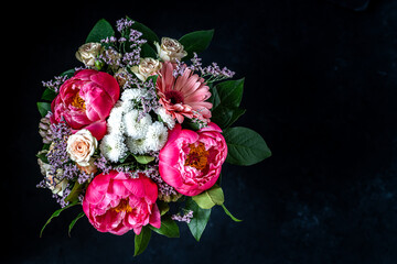 Fresh bouquet of peonies with copy space. Moody flower. Bright flower background. 