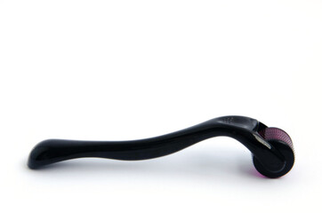 Meso roller tool for face, skin care roller for skin close up on a white background.