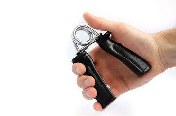Expander finger trainer, finger workout tool on a white background close up.