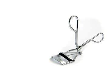 Eyelash curler, eyelash curler close up on a white background.