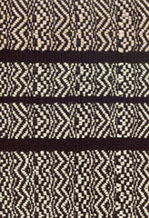Handwoven fabric in beige and brown with zigzag pattern
