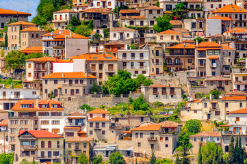 It's Houses of Arachova, Greece. A village on the green slopes of Parnassus Mountains, Greece