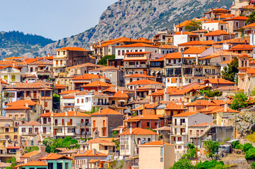 It's Houses of Arachova, Greece. A village on the green slopes of Parnassus Mountains, Greece