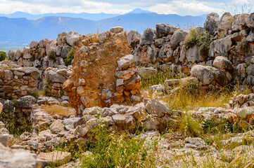 Fototapeta na wymiar It's Lion gate of Mycenae, center of Greek civilization, Peloponnese, Greece. Mycenae is a famous archaeological site in Greece. UNESCO World Heritage Site