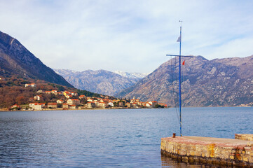Beautiful winter Mediterranean landscape. Montenegro, Adriatic Sea. View of Kotor Bay from town of Dobrota.  Prcanj town in the distance