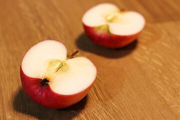 Red apple isolate on oak wood table