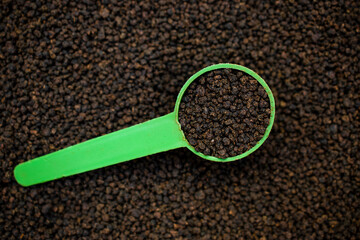 spoon of black tea powder or chai patti