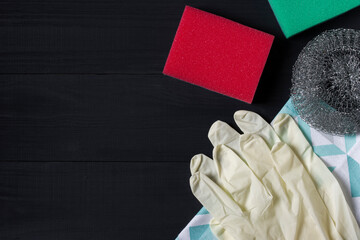 Cleaning sponges wire brush cloth and rubber gloves