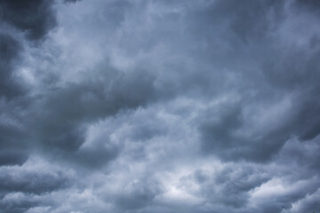 Stormy dark clouds before the storm. Textured gray and blue clouds in the sky