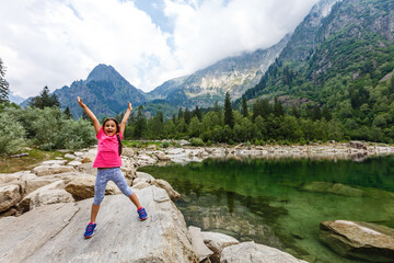 little girl looking to italy mountains