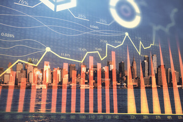 Forex chart on cityscape with tall buildings background multi exposure. Financial research concept.