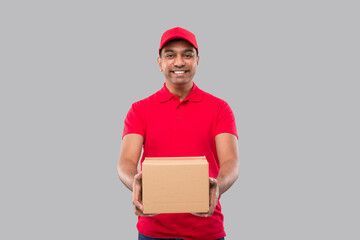 Delivery Man Box in Hands Isolated. Red Tshirt Indian Delivery Boy. Home Delivery. Quarantine Hero.