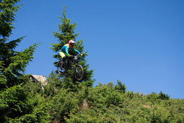  mountain biker jumping in a cycling race
