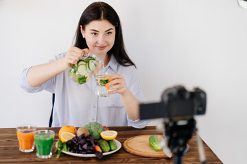 Dietary blog, healthy cooking, online channel. Nutritionist blogger recording new video with new detoxification infused water recipe