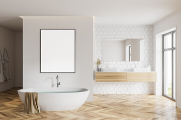 Fototapeta na wymiar White honeycomb tile bathroom tub, sink and poster