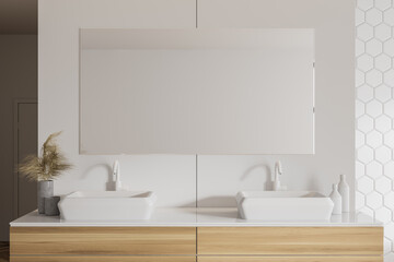 Double sink in white honeycomb tile bathroom