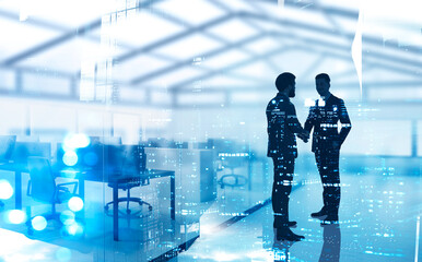 Two businessmen shaking hands in office