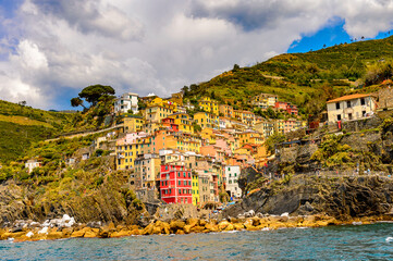 It's Beautiful sea view of Riomaggiore (Rimazuu), a village in province of La Spezia, Liguria, Italy. It's one of the lands of Cinque Terre, UNESCO World Heritage Site