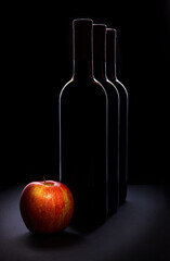 bottle of red wine and apple