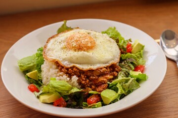 Taco rice, Japanese dish with meat, cheese and vegetables that originated in Okinawa.