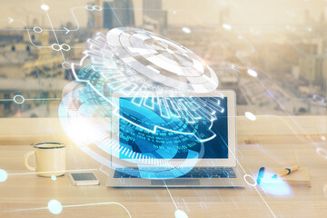 Double exposure of desktop computer and technology theme hologram. Concept of software development.