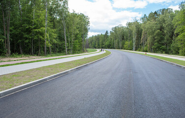 Fototapeta na wymiar new modern road through the forest