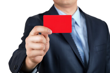 Red card. Close-up of business card in man`s hand, man in suit