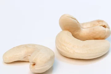 Poster Cashew nuts raw on a white background,Close up © chaphot