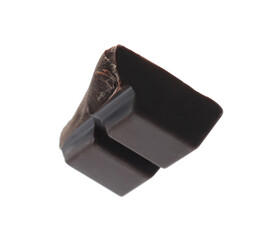 Piece of delicious dark chocolate isolated on white