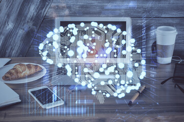 Multi exposure of work table with computer and brain hologram. Brainstorm concept.