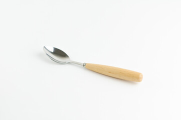 Tea spoon with a wooden handle on white background